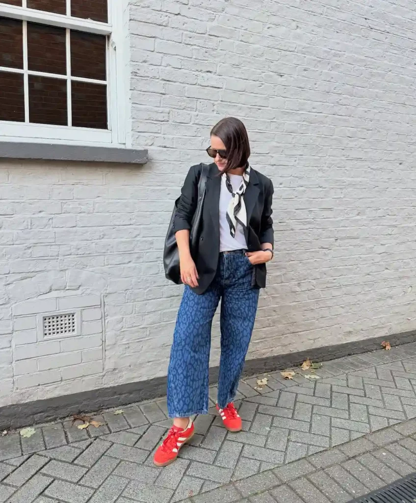 Casual Office Chic with Printed Jeans and a Black Blazer