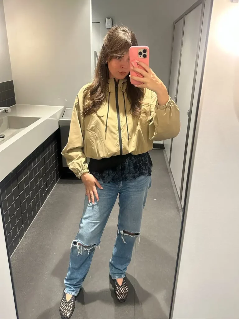 Effortless Office Cool in a Beige Windbreaker and Ripped Jeans
