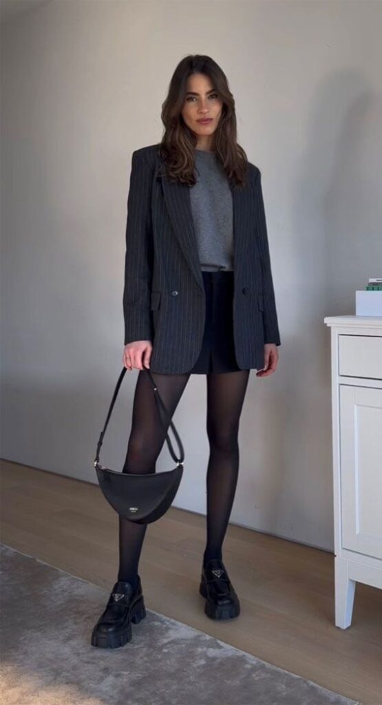 Pinstripe Blazer and Mini Skirt with Tights for a Modern Winter Office Look