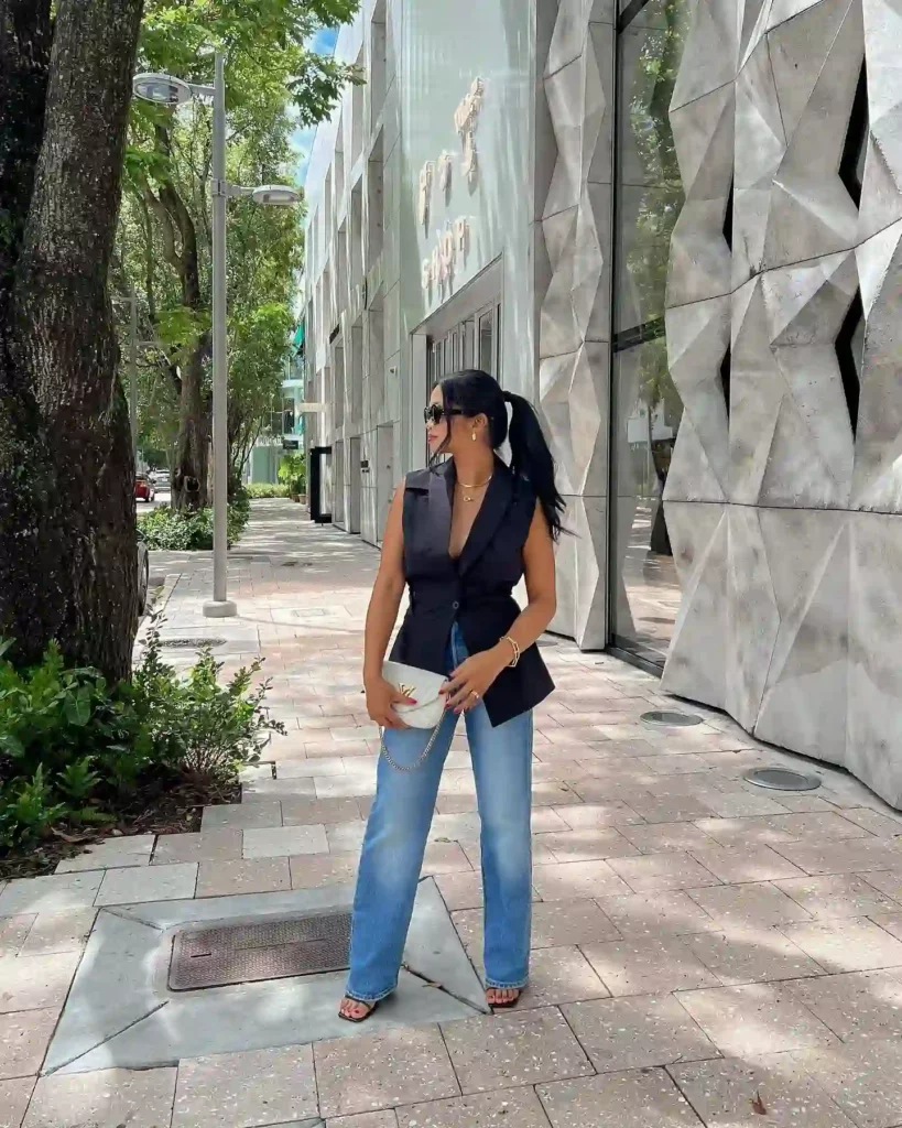 Black Sleeveless Blazer with Straight-Leg Jeans