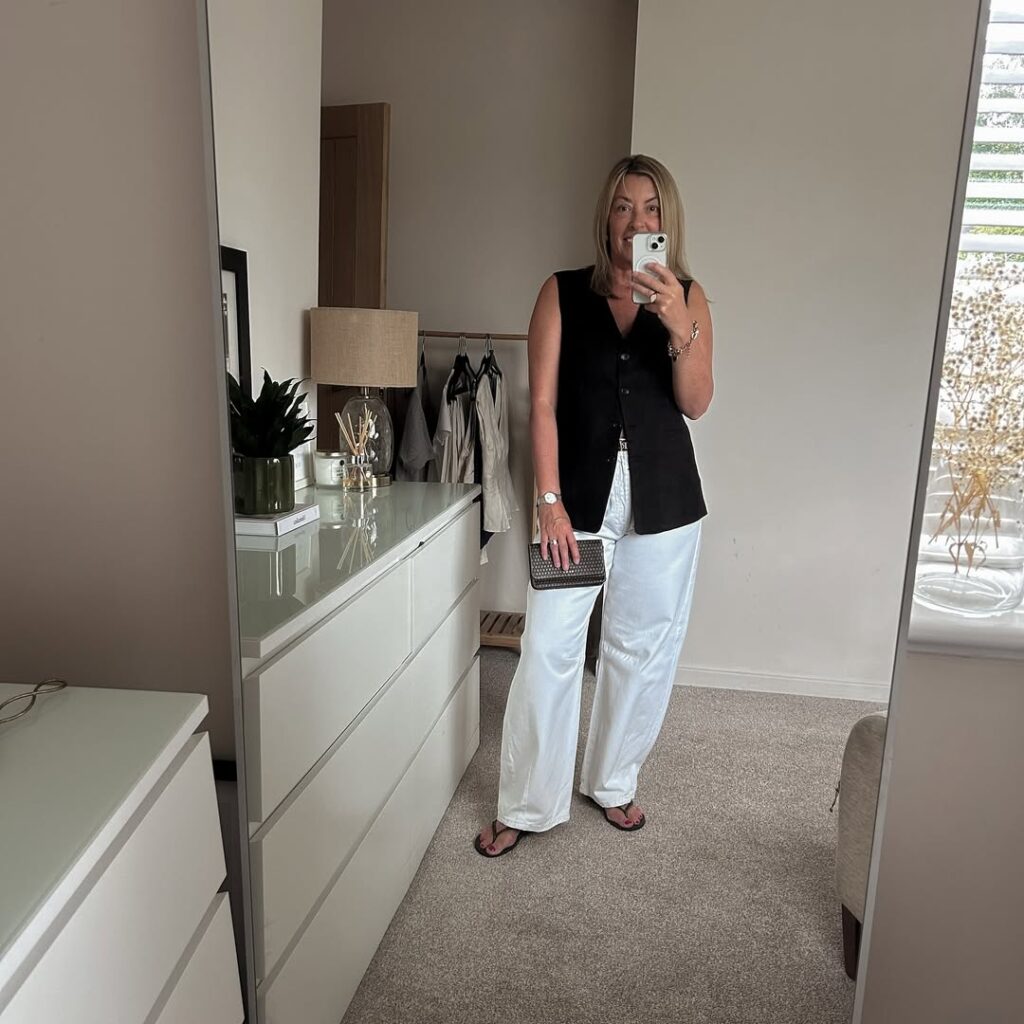 Black Vest with White Barrel Jeans Outfit