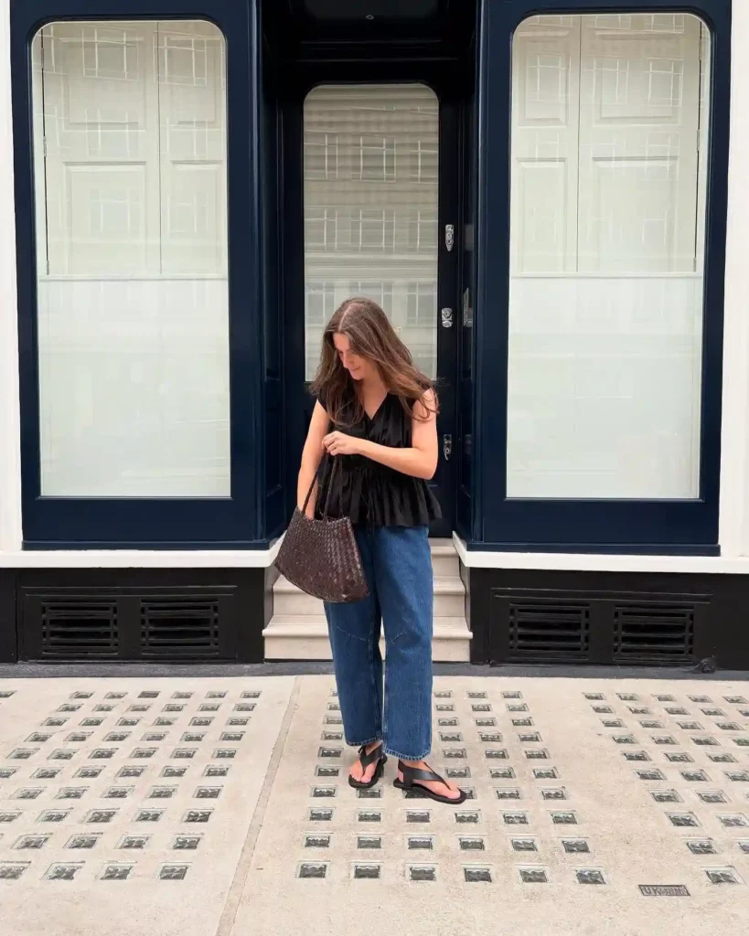 Black Ruffle Blouse with Blue Barrel Jeans Summer Outfit