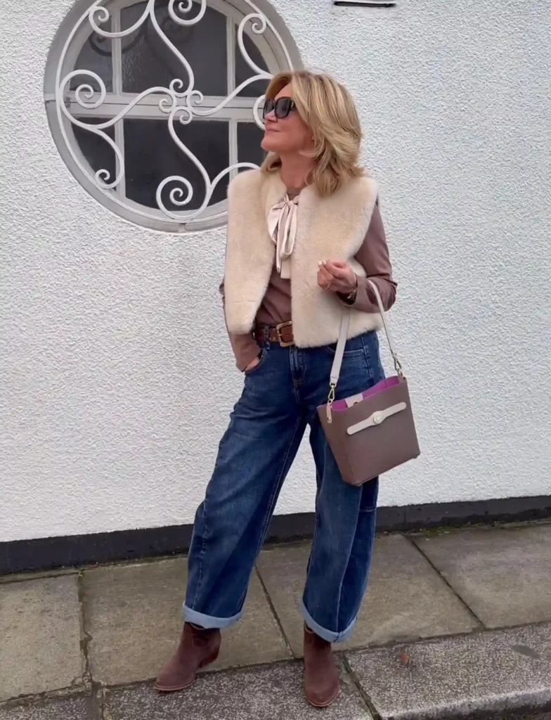 Faux Fur Vest and Bow Blouse with Dark Blue Barrel Jeans Outfit