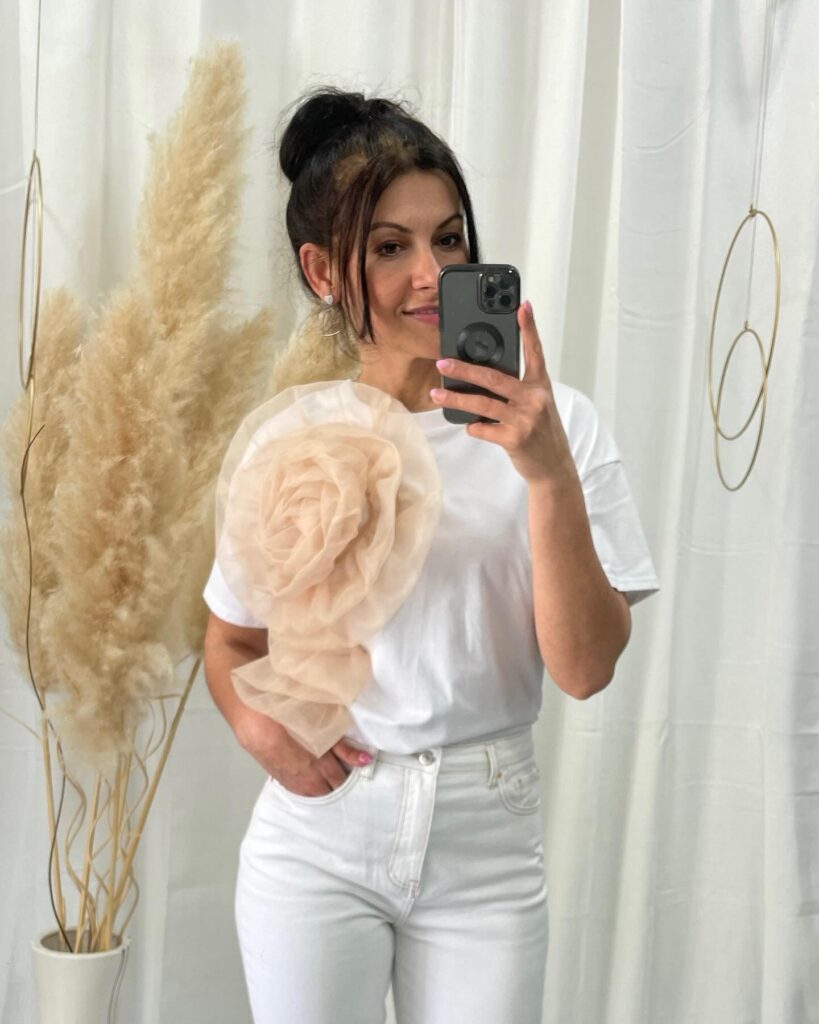 White Tee with 3D Floral Detail and Clean White Jeans