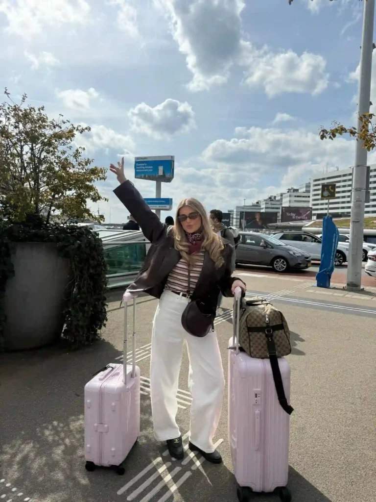 Brown Leather Jacket with Striped Top and White Barrel Jeans Outfit