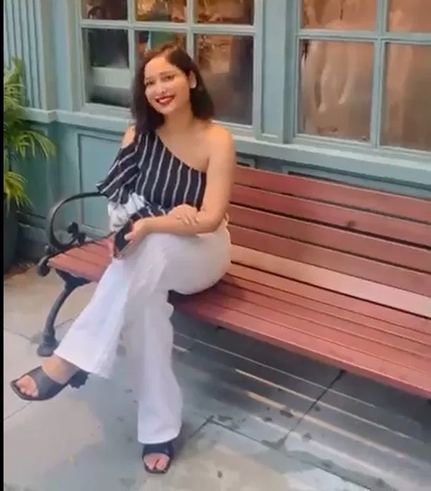 Striped One-Shoulder Top with Flared White Jeans