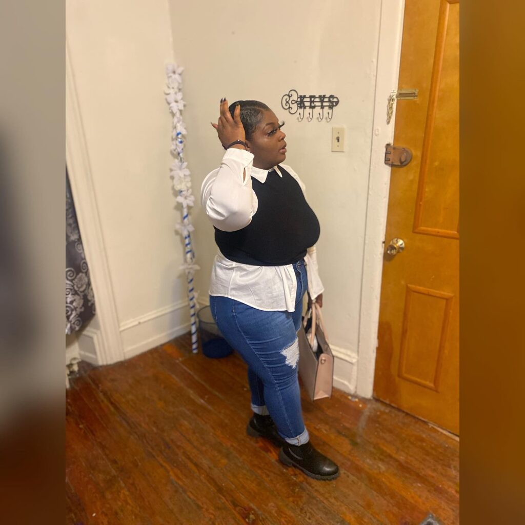 Black Sweater Vest over White Shirt with Distressed Jeans Fall Outfit