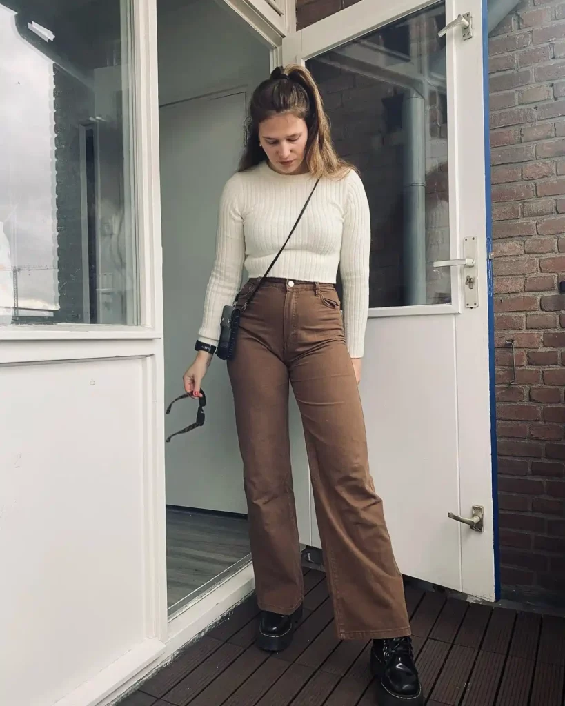 Cream Ribbed Knit Top with Flared Brown Jeans Fall Outfit