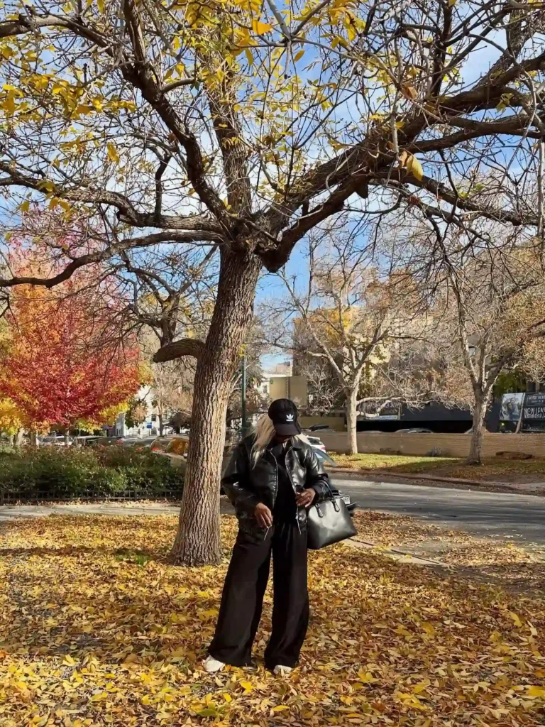All-Black Leather Jacket with Wide-Leg Jeans and Adidas Cap Fall Outfit